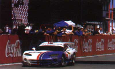 A familiar sight in 1999  Beretta and Wendlinger celebrate their dominance with another victory in the FIA GT championship. Here their ORECA Chrysler Viper wins at Zolder.