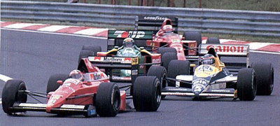 1989. Hungary. De Cesaris struggling with Mansell, Nannini and Boutsen.
